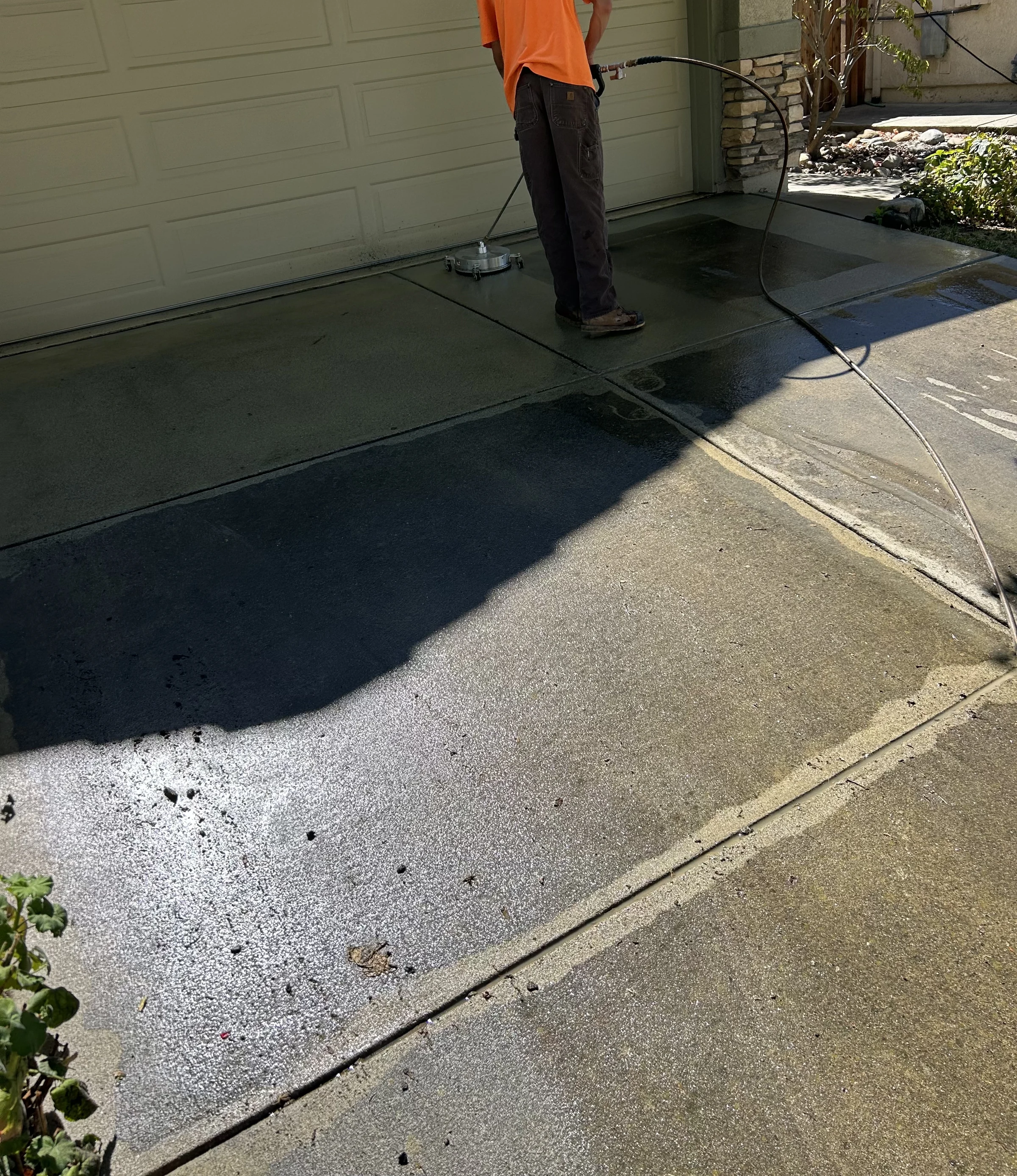 Matt washing a driveway